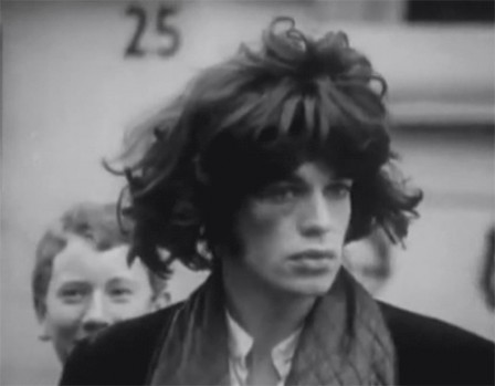 Mick Jagger wearing a Mick Jagger wig during the filming of Performance.gif