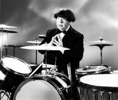 Alfred Hitchcock wearing a Beatles wig.jpg