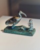 Metal statue of the god Thoth as an ibis with a devotee Thomas Prior for The New York Times la prière aux oiseaux dimanche