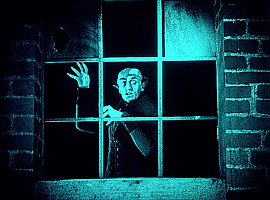 Nosferatu le vampire (Nosferatu, eine Symphonie des Grauens) Friedrich Wilhelm Murnau 1922 derrière la vitre.gif, janv. 2021