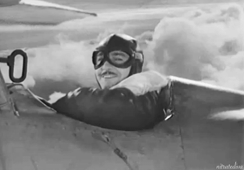 Robert Armstrong flips the bird in The Lost Squadron (1932) avion doigt d'honneur élégance Jean Mermoz message.gif, août 2020