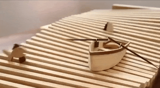 Ross McSweeney A Little Boat Floats Among Jumping Fish in a Wonderful Hand-Cranked Wooden Kinetic Wave Sculpture le vieil homme et la mer.gif, mar. 2021