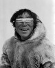 Smiling Inuit man wearing bone snow goggles lunettes froid hiver ski.jpg